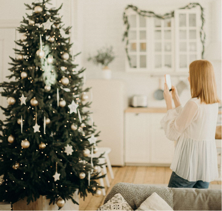 Decorating Unlit Artificial Christmas Trees with Pink Ornaments to Bring Music and Soul to Charity